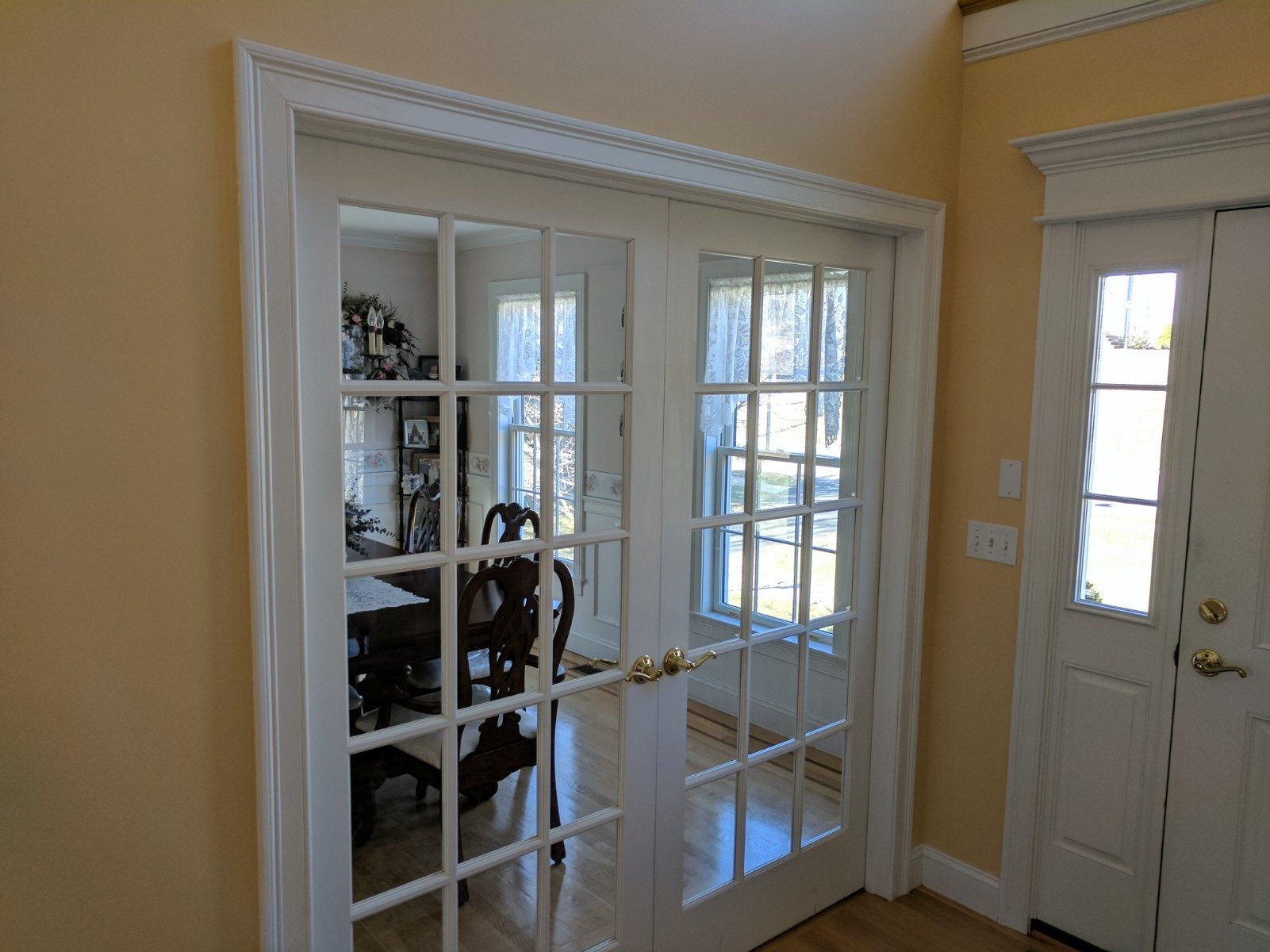 View through french door into formal dining room