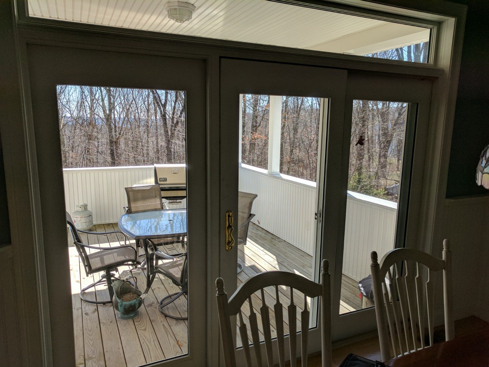 Sliding and fixed slider leading to semi-enclosed porch